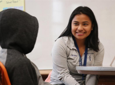 Student mentoring fellow student 